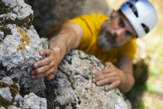 medium-shot-man-climbing-mountains